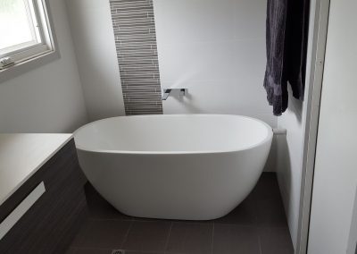 Stylish white bath tub installed for a client