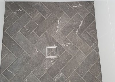 Herringbone Pattern on Shower floor and over floor grate in Tennyson