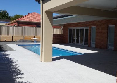 Tiling around Swimming Pool - 600x600 Salt & Pepper Granite Tiles